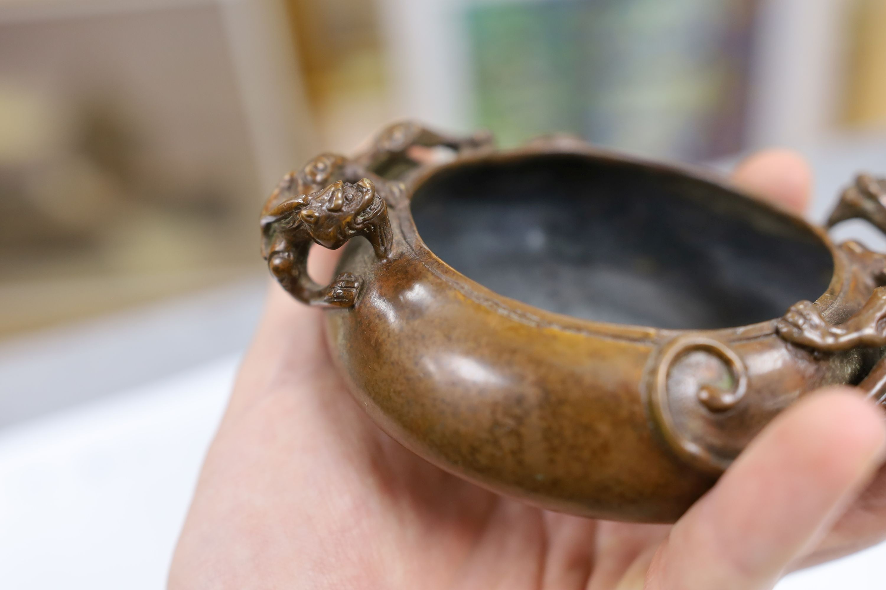 Two Chinese bronze censers, largest 11cms diameter